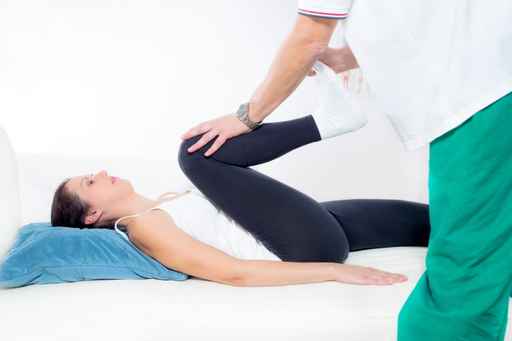 Chiropractor Works on the Patient Leg